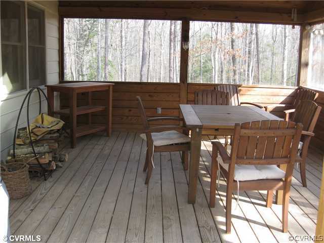 17182 White Pine Road Beaverdam, VA 23015 - Photo 9 of 12 a view of a dining room with furniture window and wooden floor