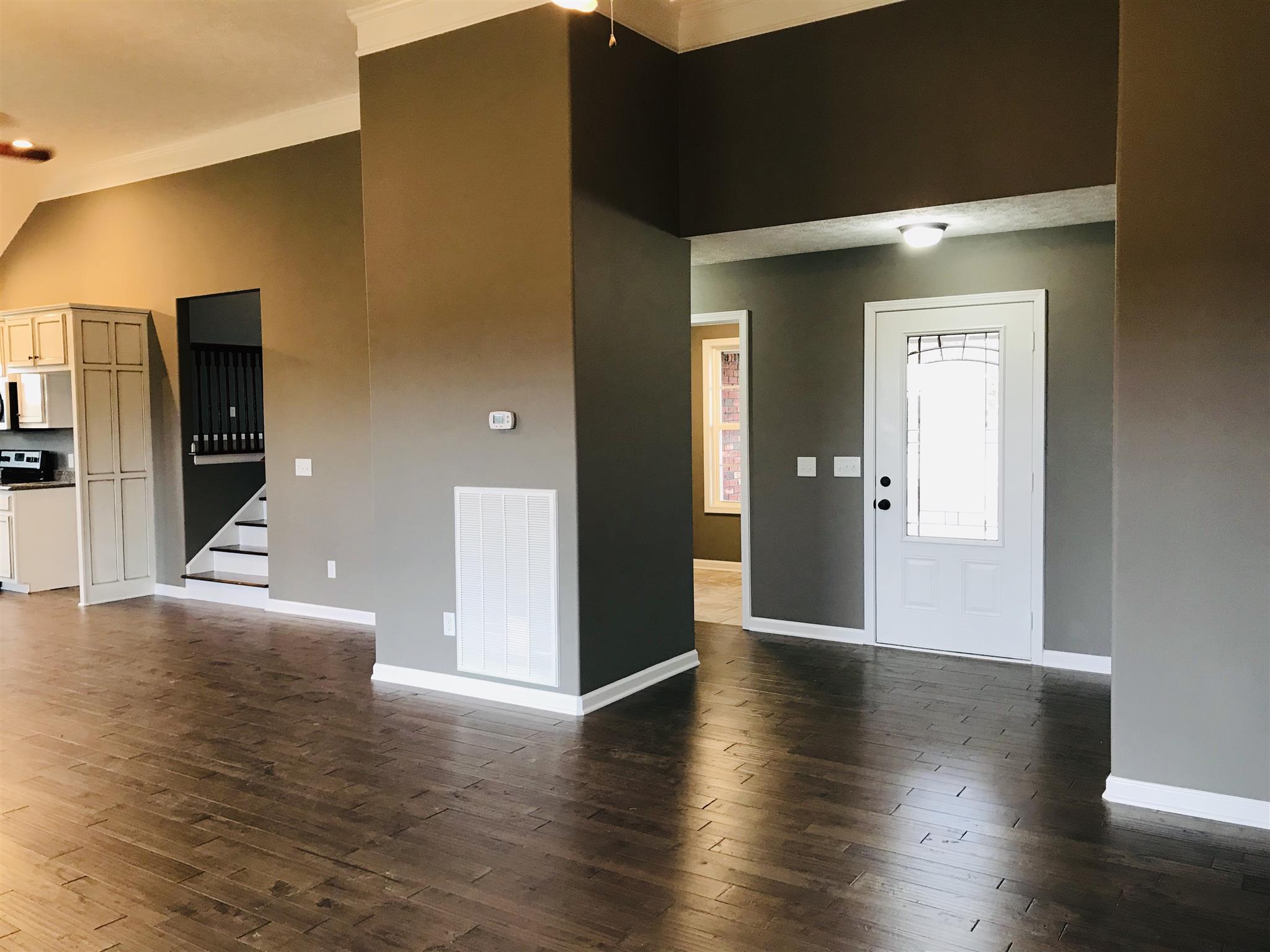 426 Fowler Ford Road Portland, TN 37148 - Photo 5 of 19 a view of a hallway with wooden floor