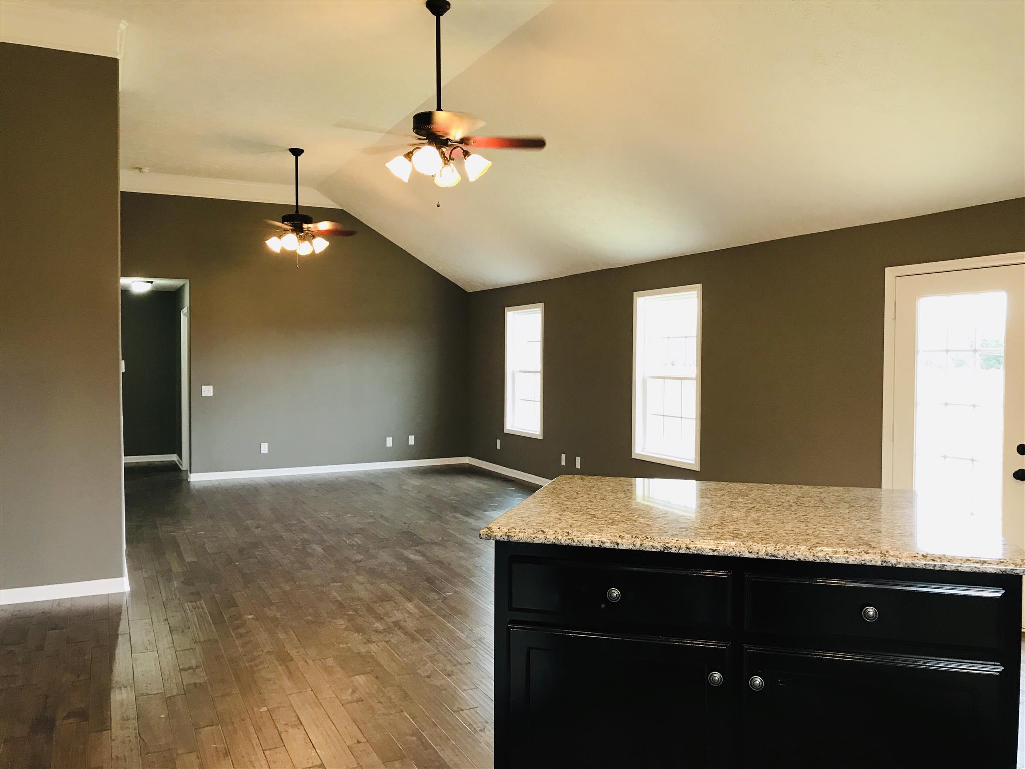 426 Fowler Ford Road Portland, TN 37148 - Photo 6 of 19 a bathroom with a granite countertop sink a vanity and a mirror