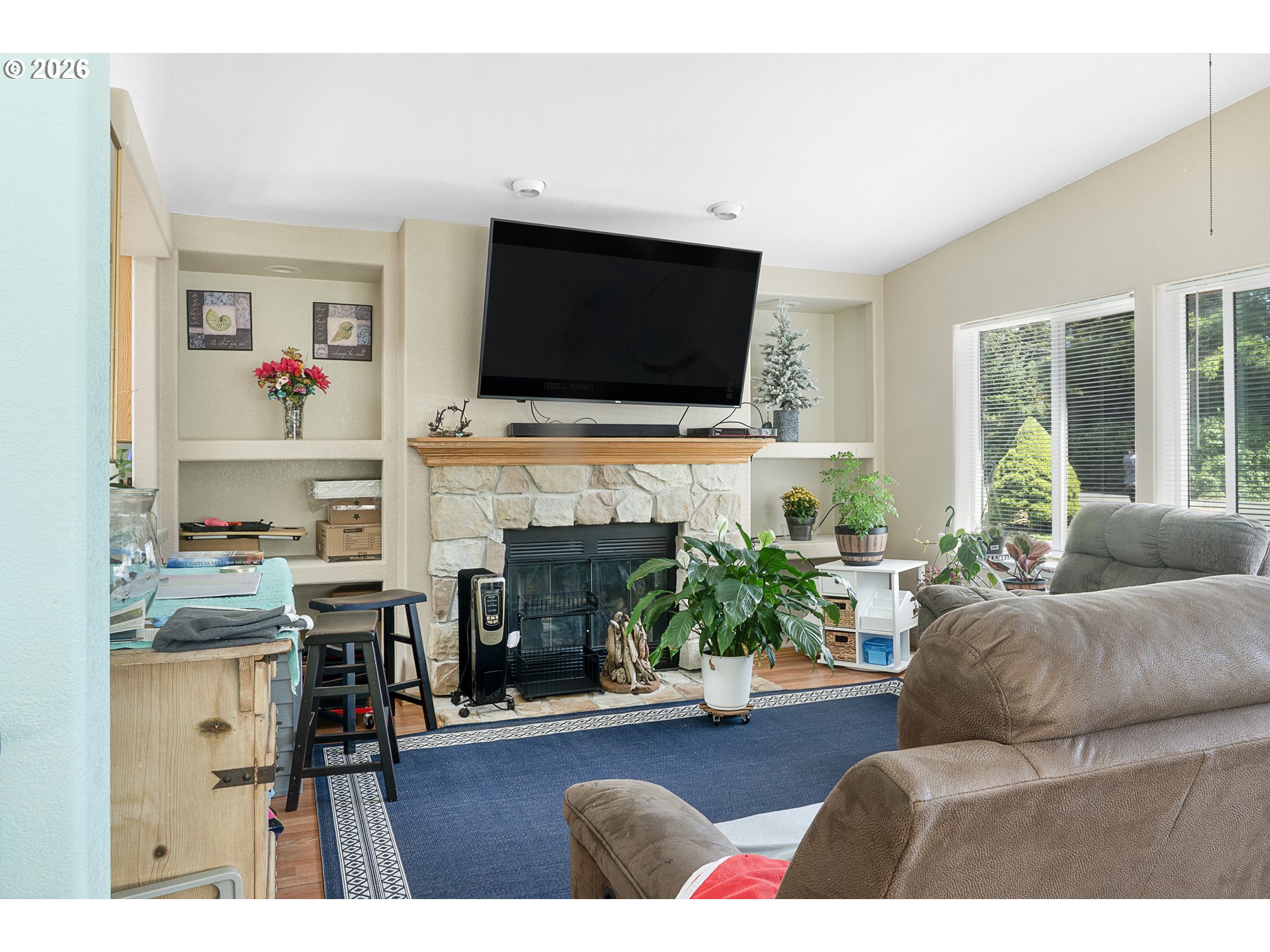 96465 Coverdell Road, Unit 8 Brookings, OR 97415 - Photo 11 of 16 a living room with furniture fireplace and flat screen tv