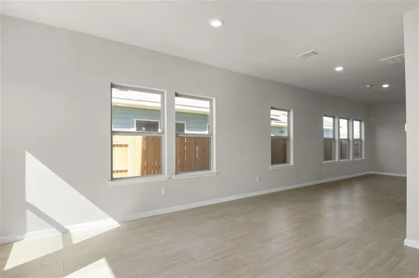 a view of an empty room with a window