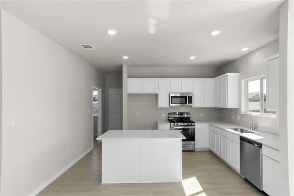 a large kitchen with cabinets
