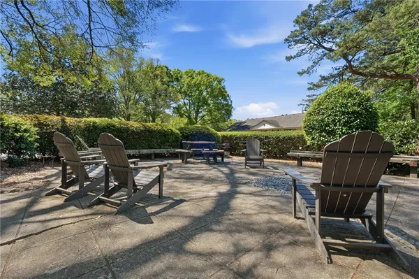 a view of a backyard with sitting area and furniture