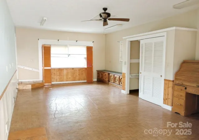 a view of empty room with a fireplace