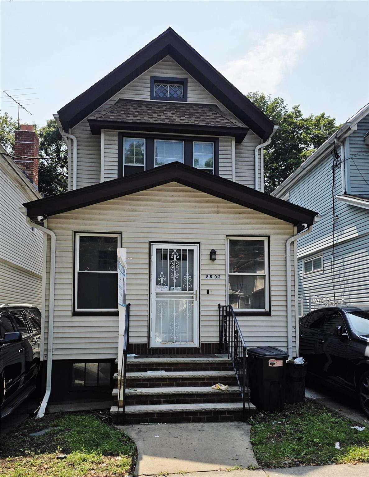 85-92 98th Street Queens, NY 11421 - Photo 1 of 1 American foursquare style home featuring entry steps