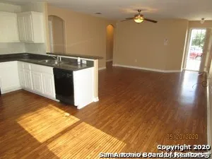 a kitchen that has a sink and a stove in it