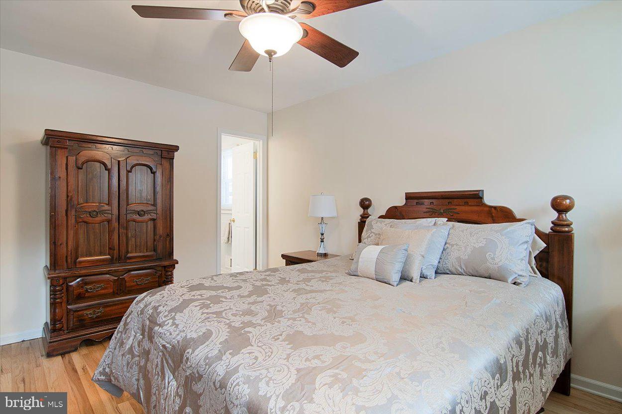 10 Elizabeth Court Edison, NJ 08817 - Photo 13 of 38 a bedroom with a bed and wooden floor