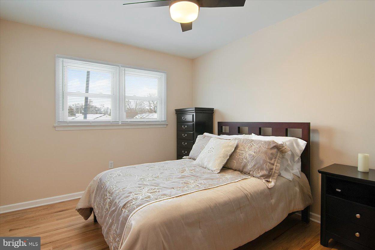 10 Elizabeth Court Edison, NJ 08817 - Photo 15 of 38 a bedroom with a bed and wooden floor