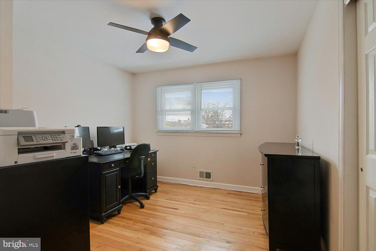 10 Elizabeth Court Edison, NJ 08817 - Photo 18 of 38 a view of a workspace with wooden floor and a window
