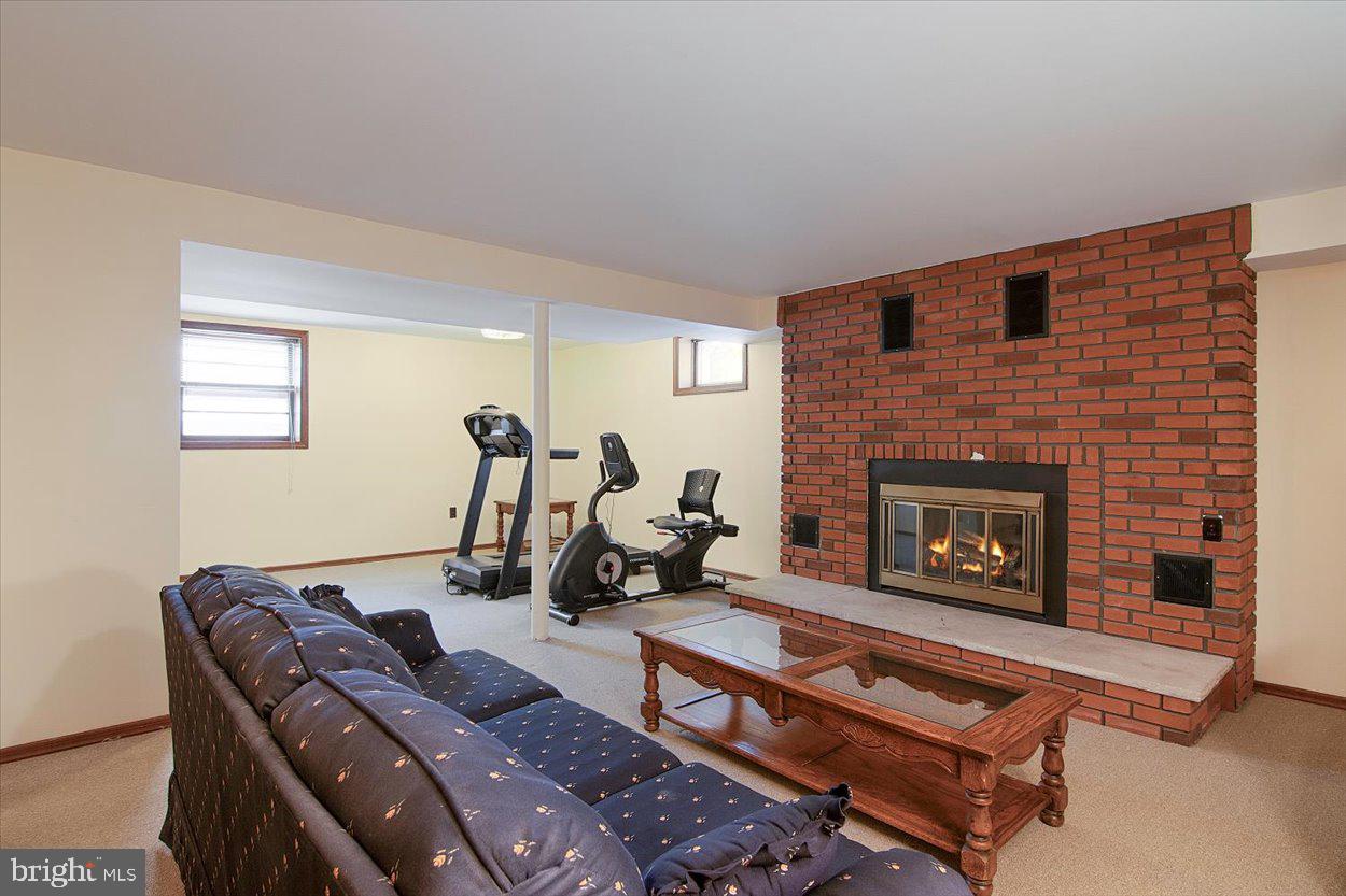 10 Elizabeth Court Edison, NJ 08817 - Photo 20 of 38 a living room with furniture and a fireplace