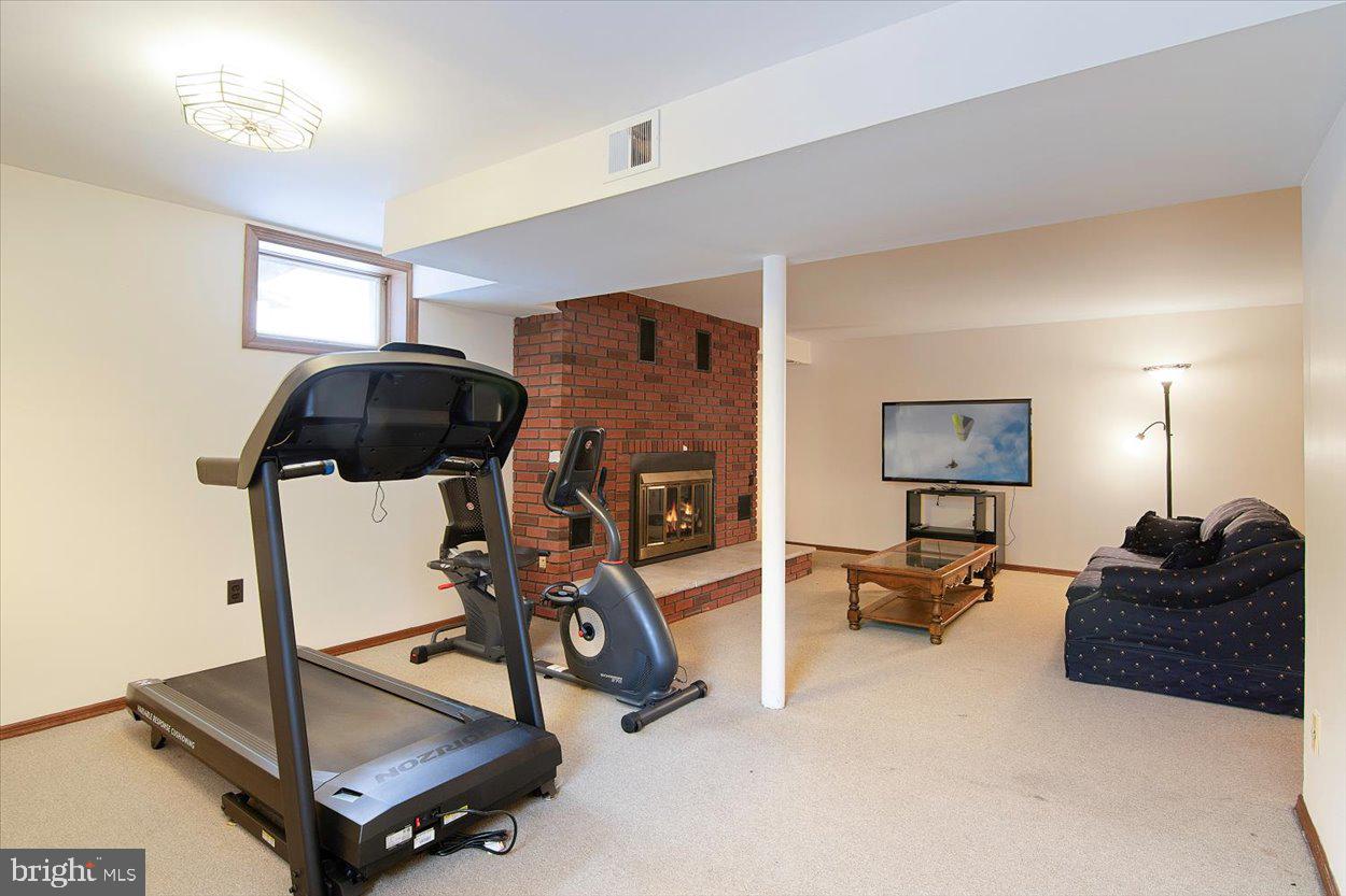10 Elizabeth Court Edison, NJ 08817 - Photo 23 of 38 a living room with furniture and a flat screen tv