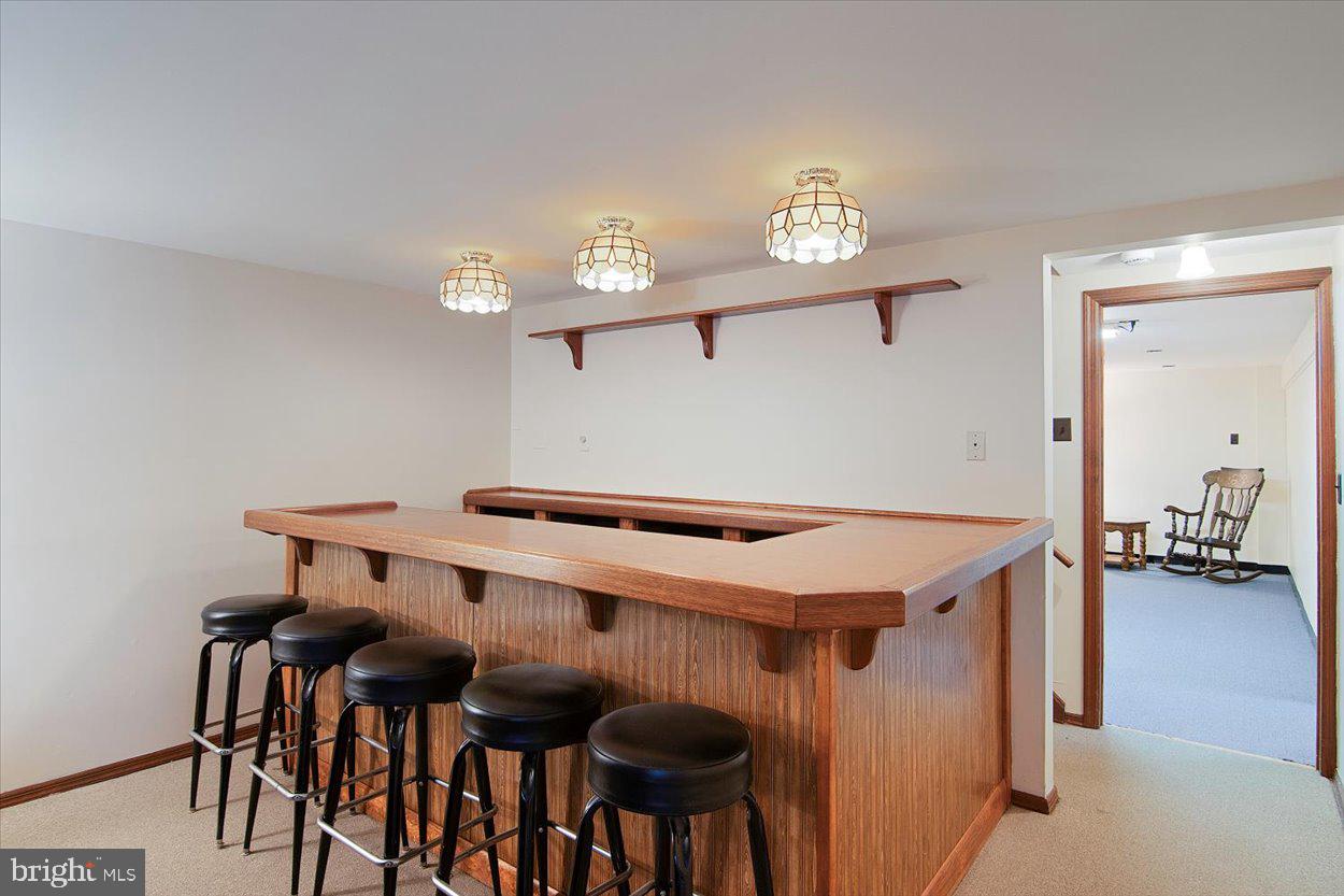 10 Elizabeth Court Edison, NJ 08817 - Photo 24 of 38 a room with furniture and a chandelier