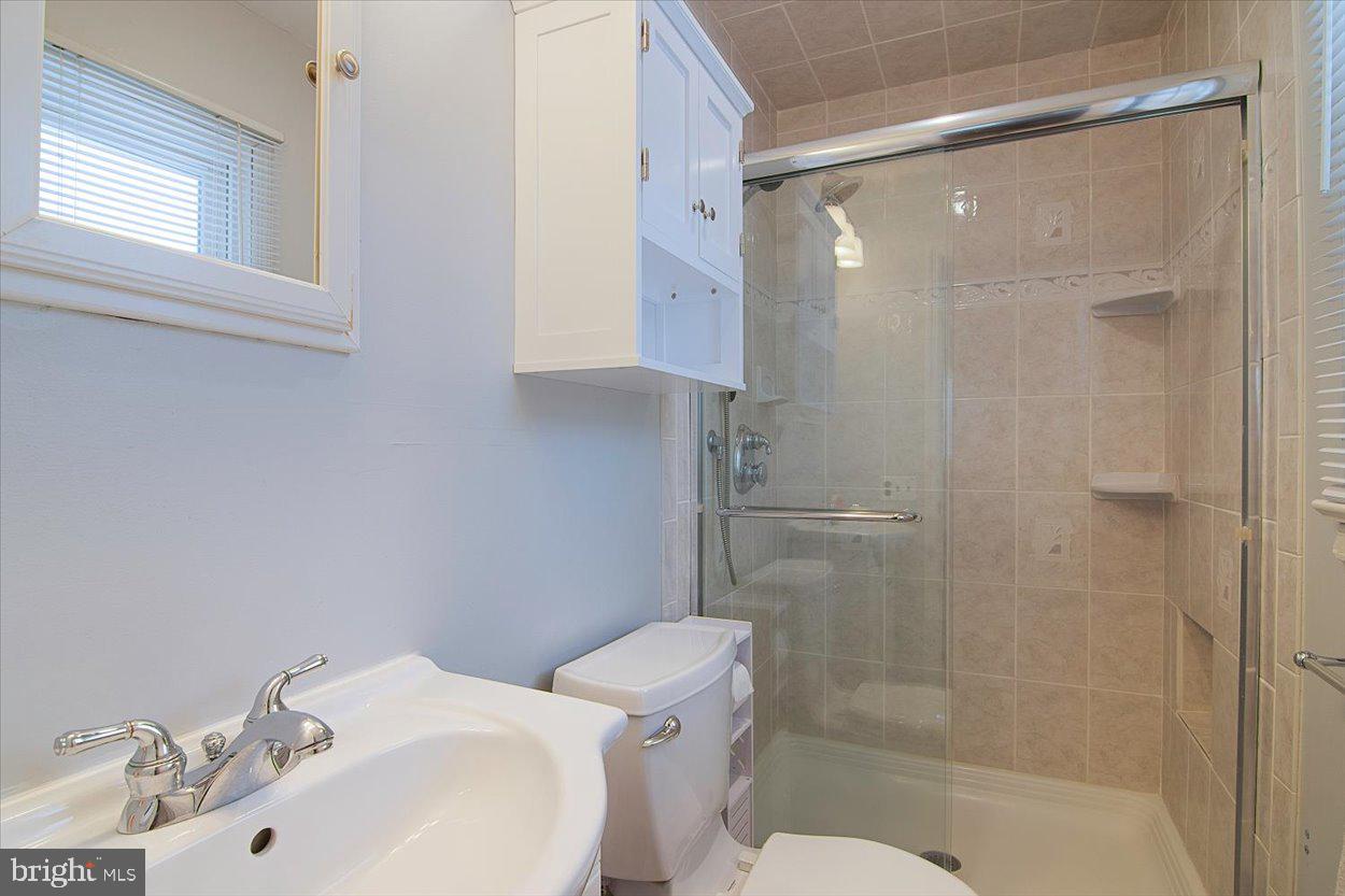 10 Elizabeth Court Edison, NJ 08817 - Photo 25 of 38 a bathroom with a sink toilet and shower