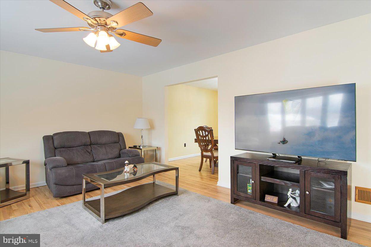 10 Elizabeth Court Edison, NJ 08817 - Photo 6 of 38 a living room with furniture and a flat screen tv