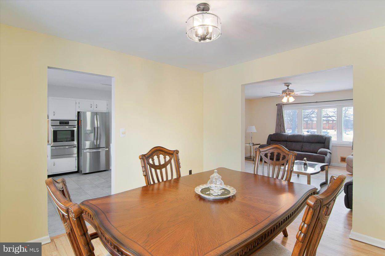 10 Elizabeth Court Edison, NJ 08817 - Photo 8 of 38 a view of a dining room with furniture and wooden floor