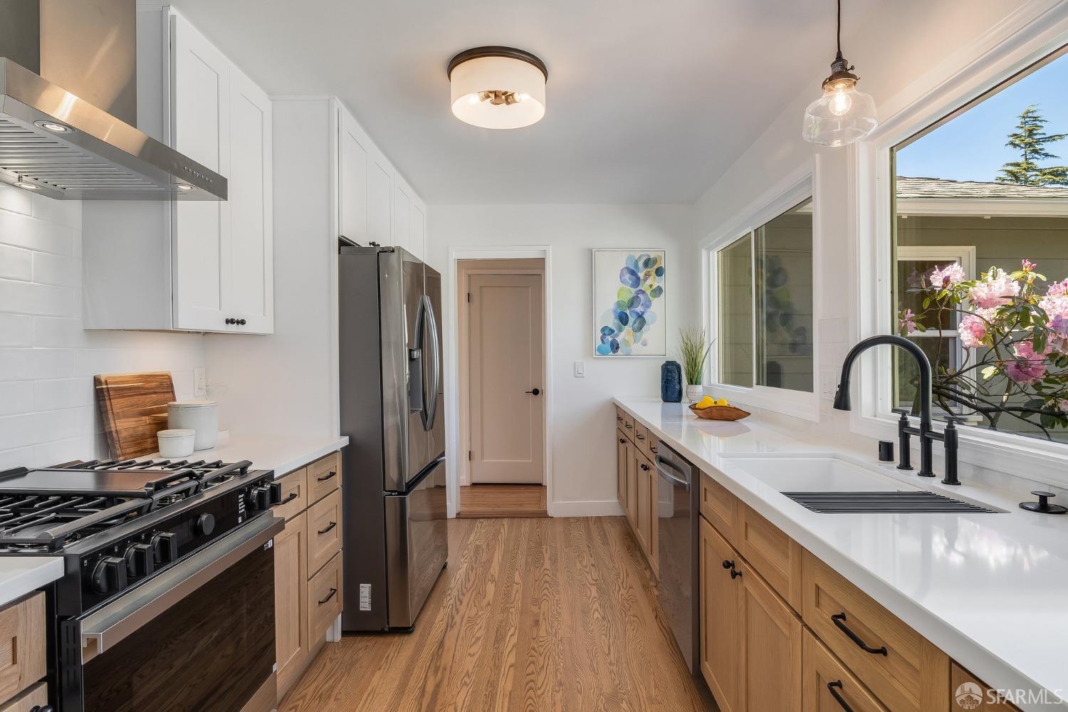 771 Creston Road Berkeley, CA 94708 - Photo 18 of 45 a kitchen with stainless steel appliances granite countertop a sink stove and refrigerator