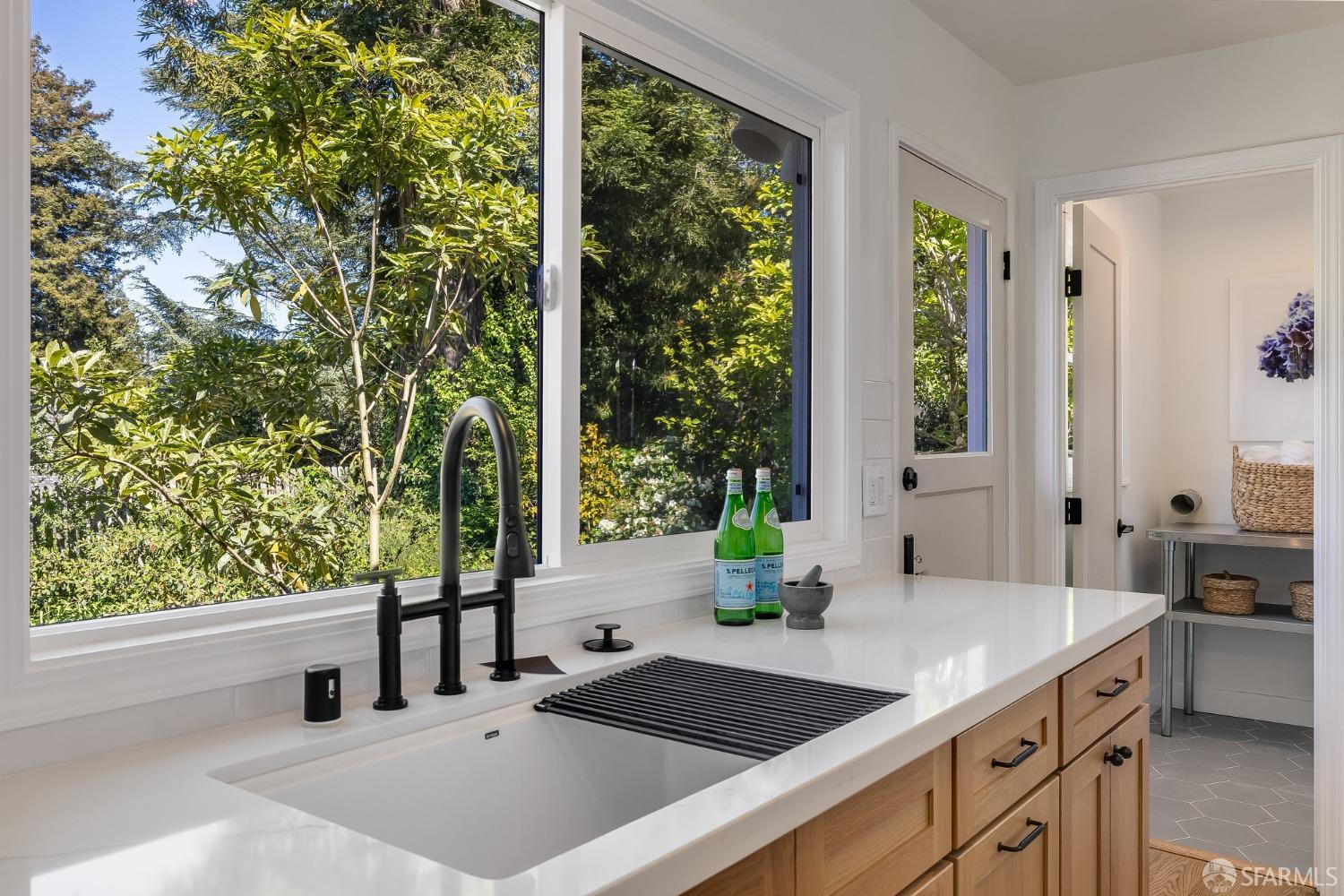 771 Creston Road Berkeley, CA 94708 - Photo 20 of 45 a kitchen with a sink and large window