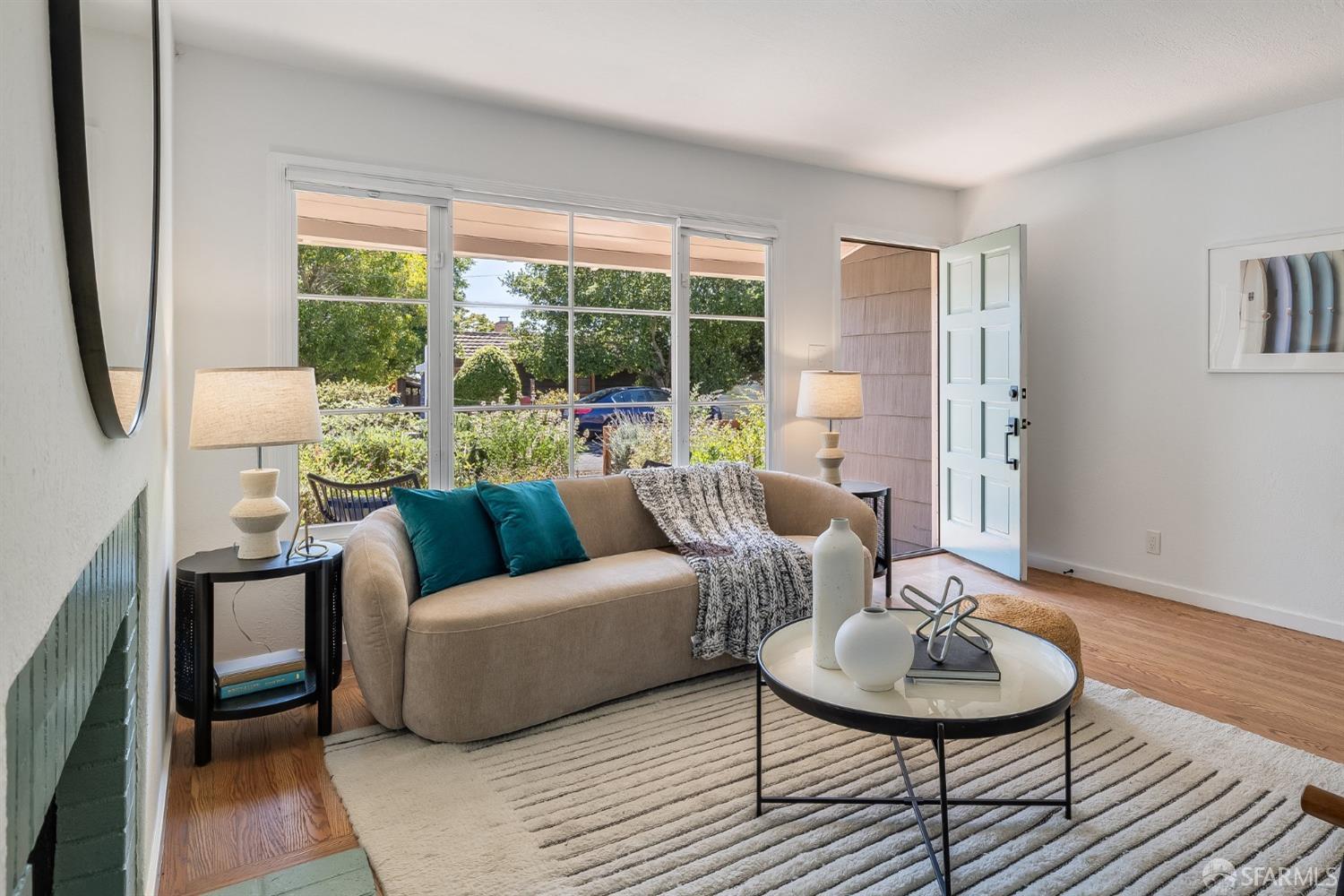 771 Creston Road Berkeley, CA 94708 - Photo 10 of 45 a living room with furniture and a large window