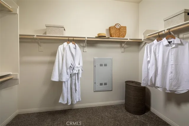 a view of a dining room with furniture and a window
