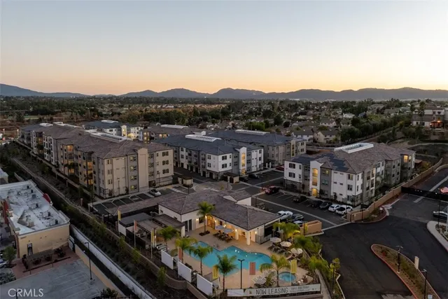 a view of a patio with couches and a fire pit