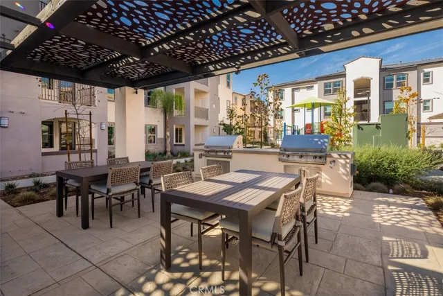 a view of a patio with a table and chairs