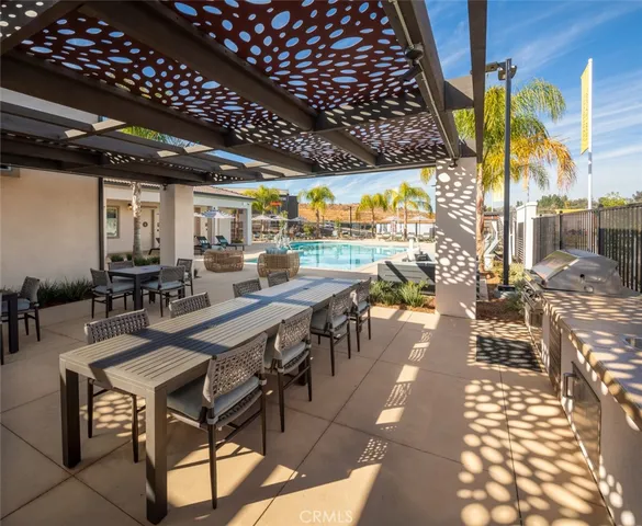 a view of a patio with swimming pool