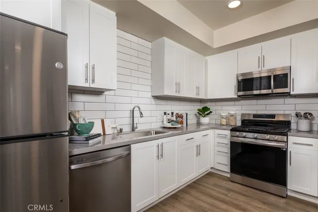 a bathroom with a sink a toilet and a shower