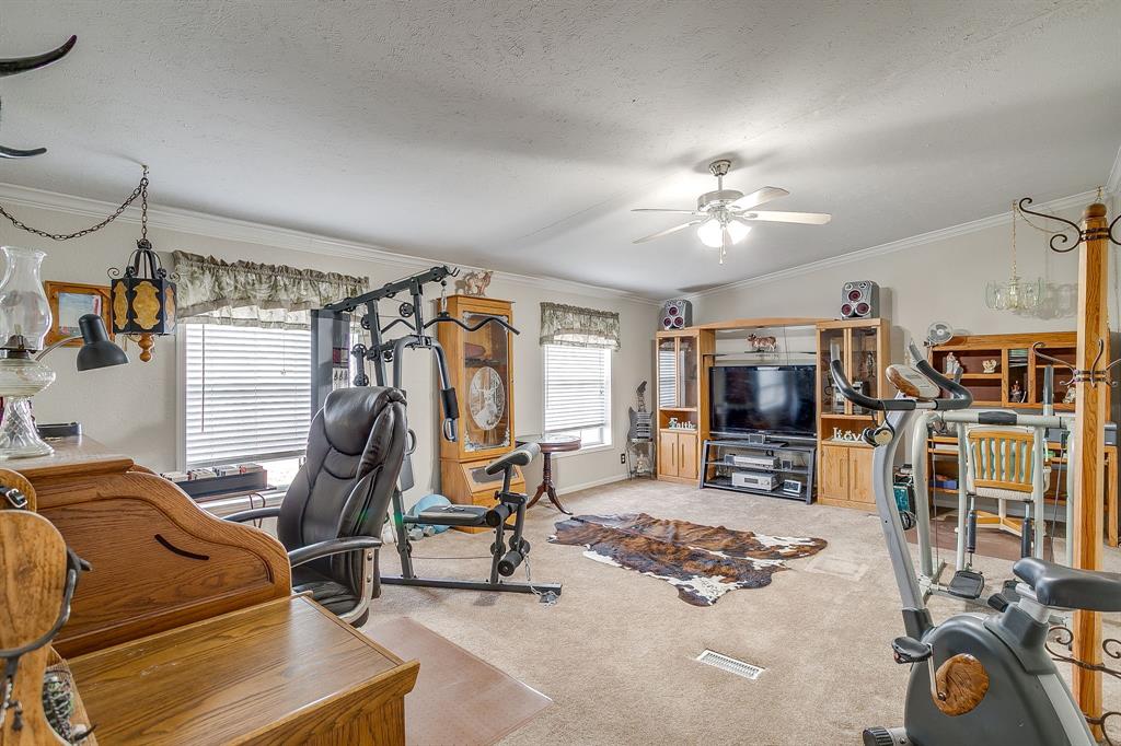 6724 Midway Road Springtown, TX 76082 - Photo 18 of 39 a view of a room with gym equipment