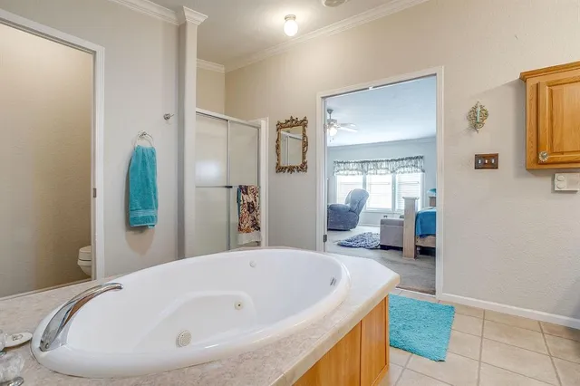 a bathroom with a tub and sink
