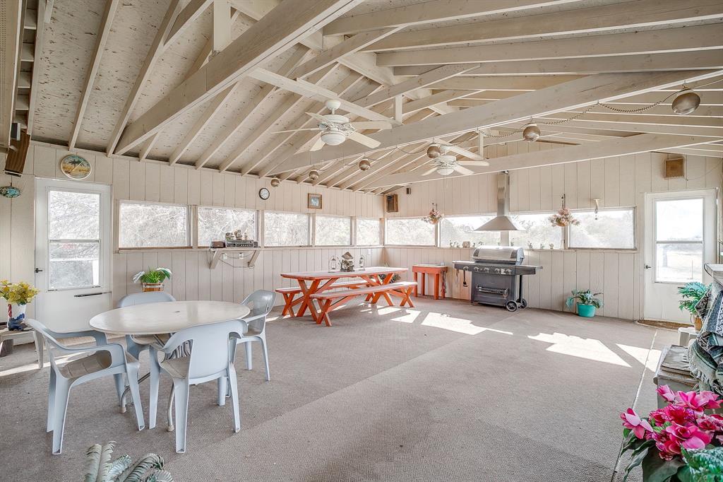 6724 Midway Road Springtown, TX 76082 - Photo 33 of 39 a room with lots of furniture and clutter