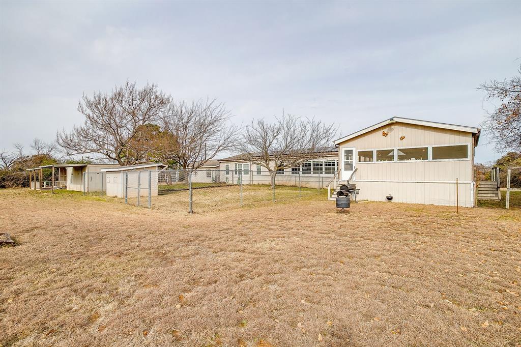 6724 Midway Road Springtown, TX 76082 - Photo 35 of 39 a front view of a house with a yard