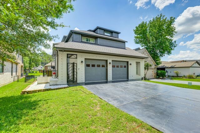 3362 Desert Inn Drive Montgomery, TX 77356 - Photo 41 of 50 a front view of a house with a yard and garage