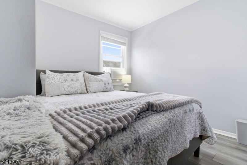 32 Cedar Avenue Elizabeth, NJ 07202 - Photo 18 of 32 a bedroom with a bed and a window
