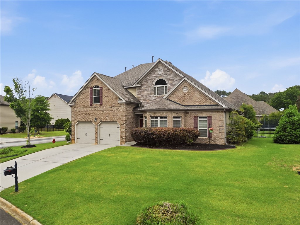 138 Buckland Drive Anderson, SC 29621 - Photo 3 of 49 This classic brick and stone residence boasts a manicured lawn and attached garage.