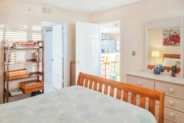 a bedroom with two beds and a window