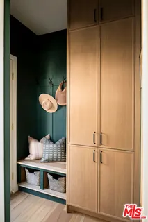 a bedroom with a bed couch and window