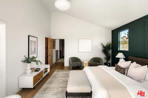 a bedroom with bed and a window