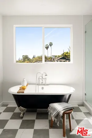 a utility room with cabinets washer and dryer