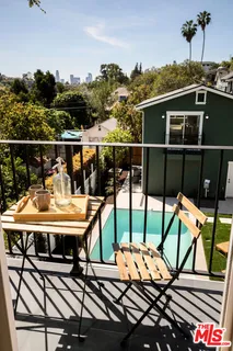 a view of a swimming pool and lounge chairs