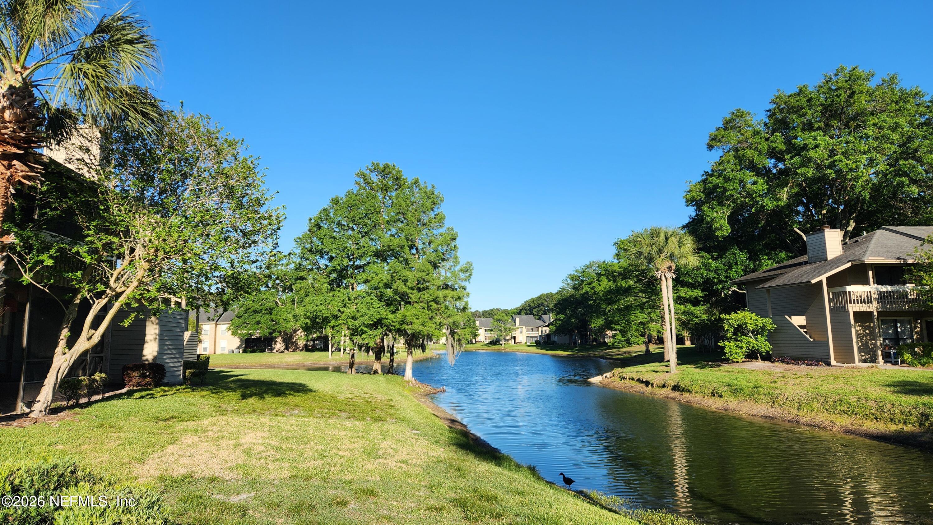 10200 Belle Rive Boulevard, Unit 96 Jacksonville, FL 32256 - Photo 16 of 19 a view of a house with swimming pool and sitting area