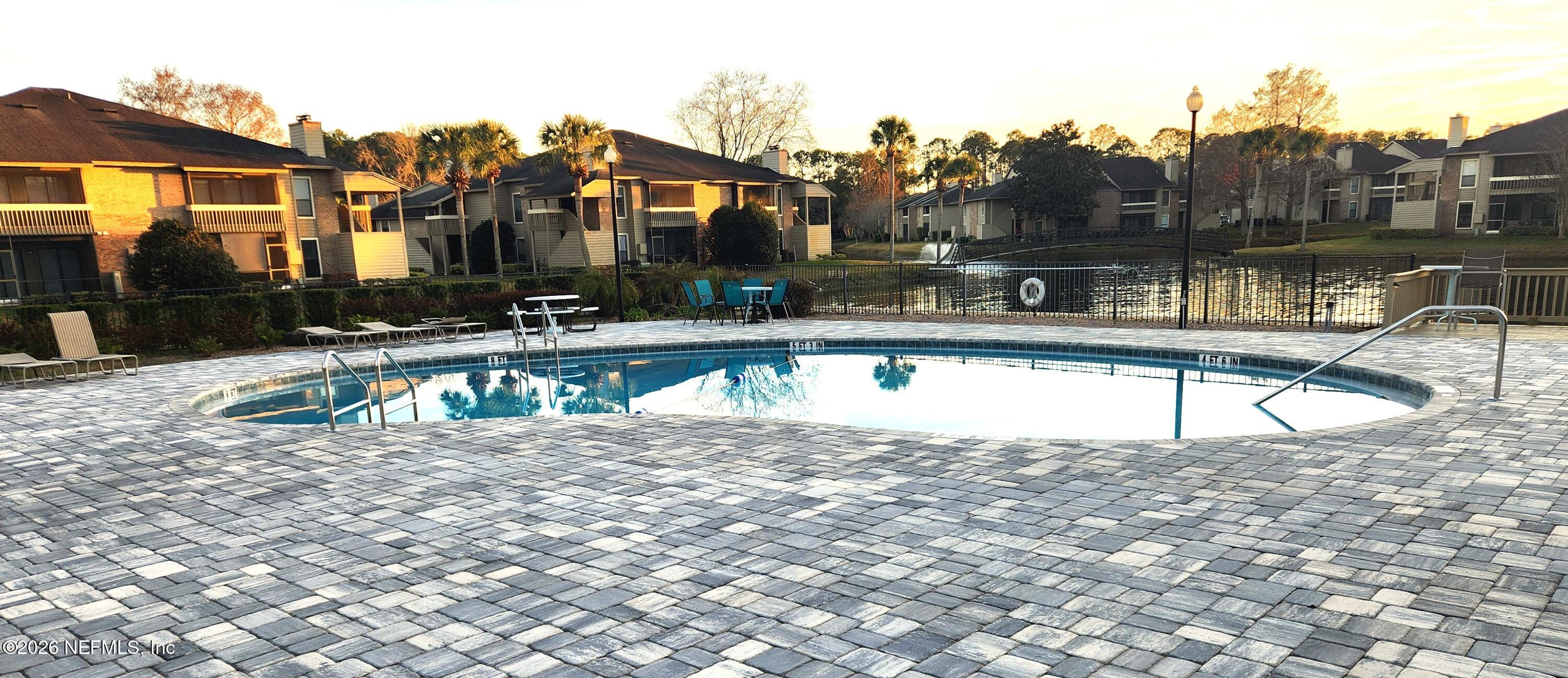 10200 Belle Rive Boulevard, Unit 96 Jacksonville, FL 32256 - Photo 17 of 19 a view of a house with a swimming pool