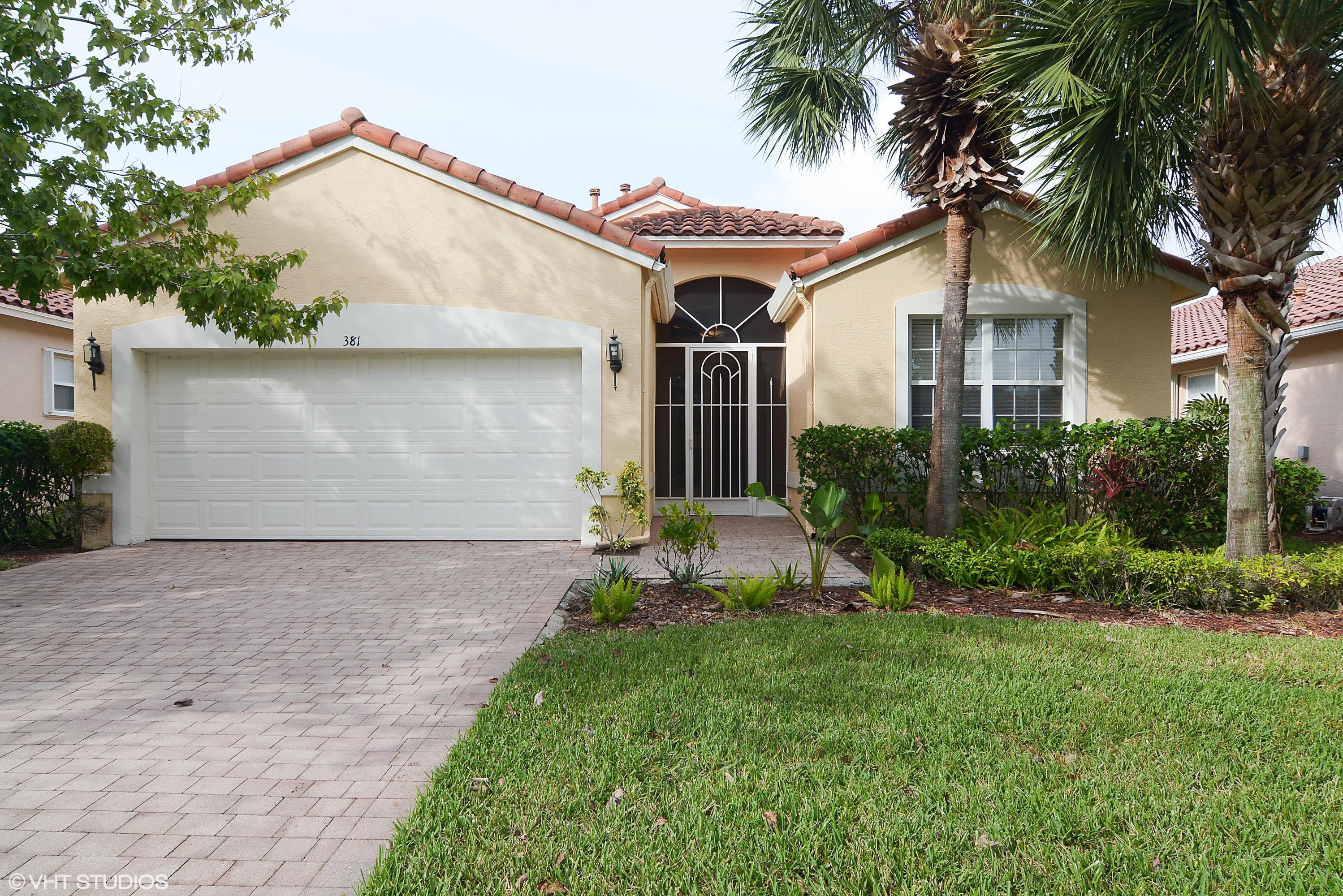 381 Springview Loop Port St. Lucie, FL 34986 - Photo 1 of 10 01_381nwSpringviewLoop_57_FrontView_HiRe