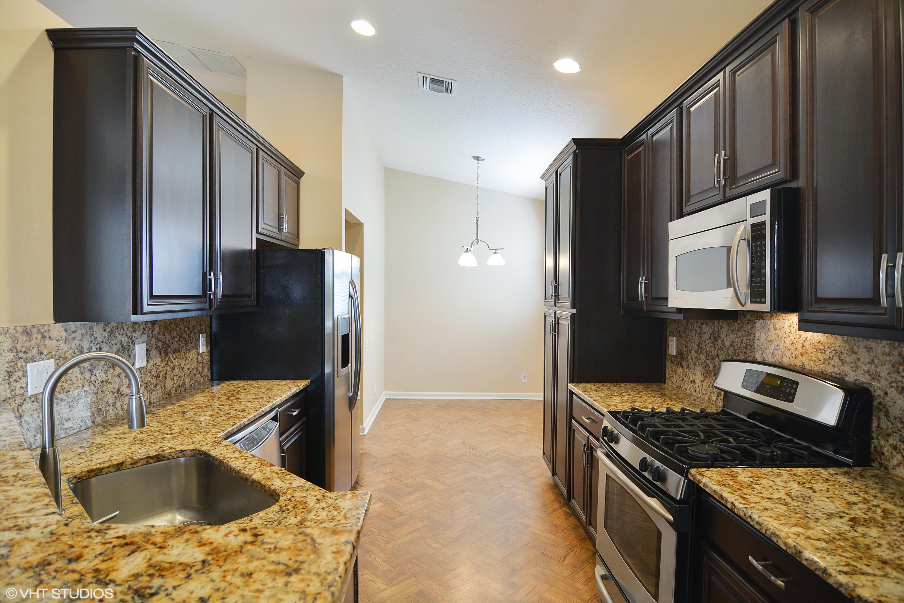 381 Springview Loop Port St. Lucie, FL 34986 - Photo 3 of 10 03_381nwSpringviewLoop_5_Kitchen_HiRes