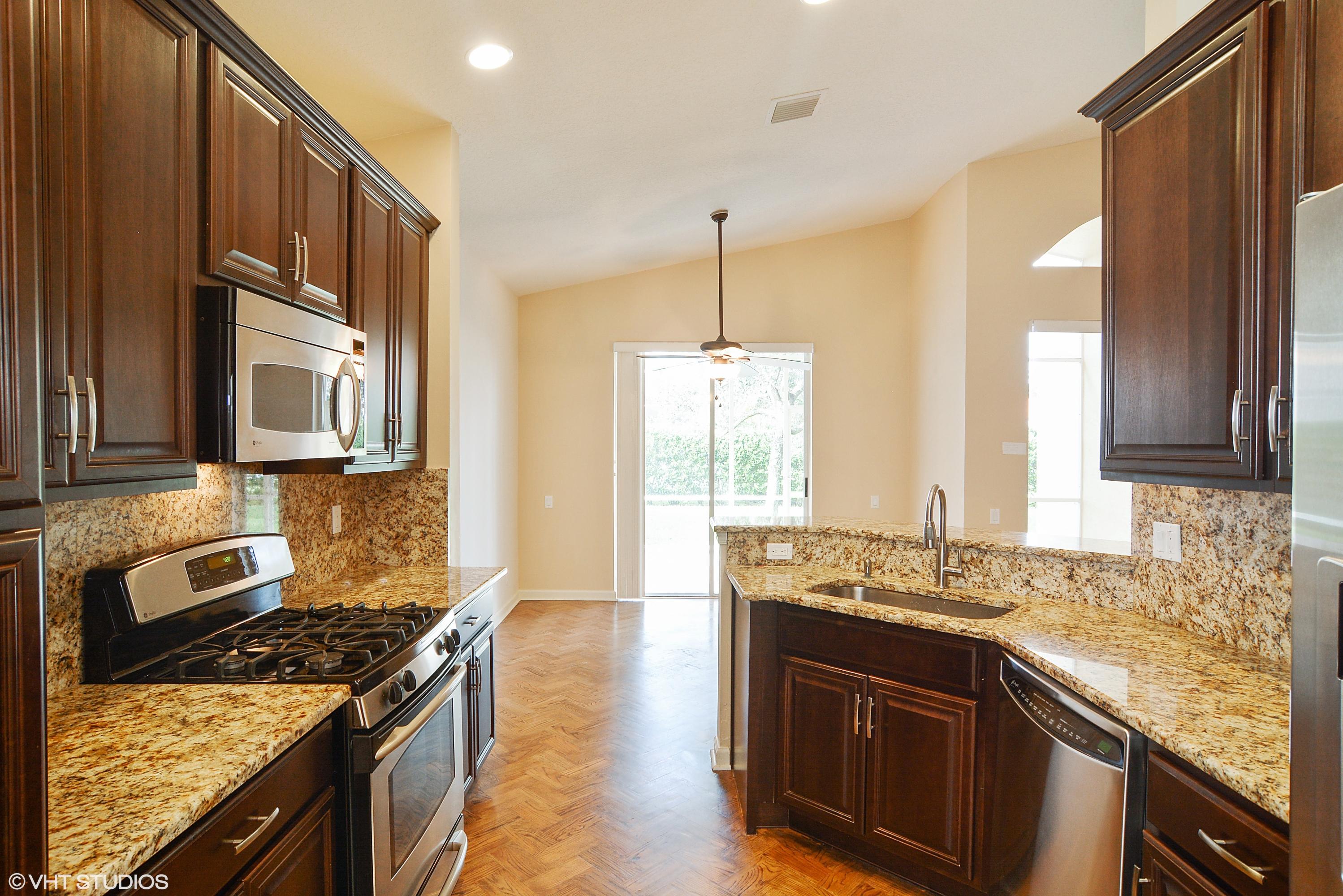 381 Springview Loop Port St. Lucie, FL 34986 - Photo 4 of 10 04_381nwSpringviewLoop_177_Kitchen_HiRes