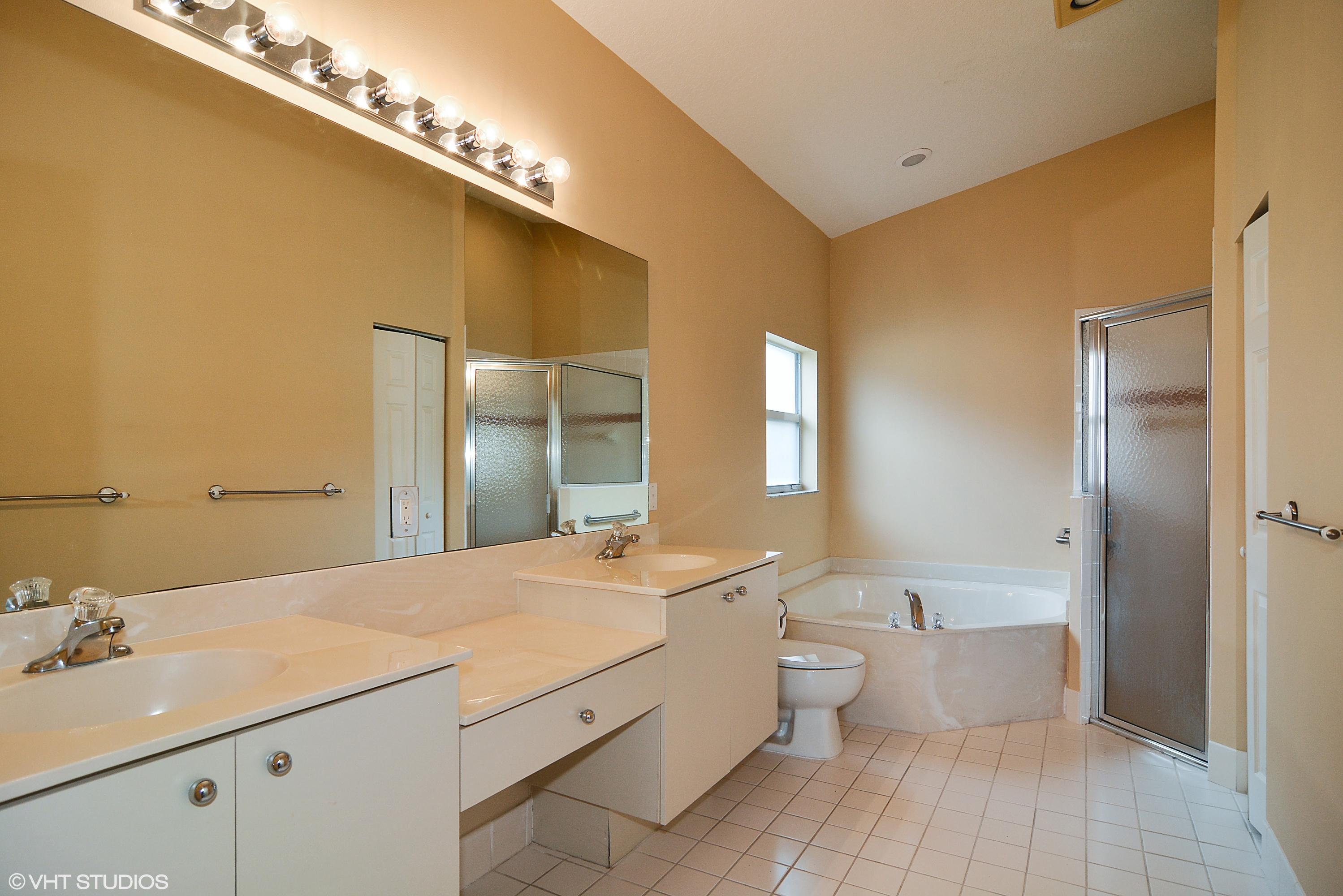 381 Springview Loop Port St. Lucie, FL 34986 - Photo 7 of 10 07_381nwSpringviewLoop_13_MasterBathroom