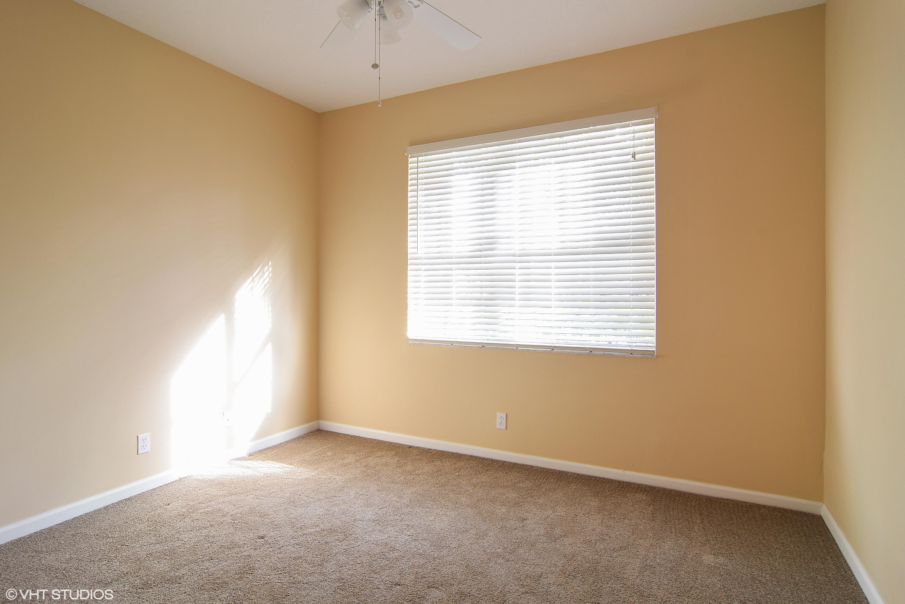381 Springview Loop Port St. Lucie, FL 34986 - Photo 9 of 10 09_381nwSpringviewLoop_15_GuestBedroom_H