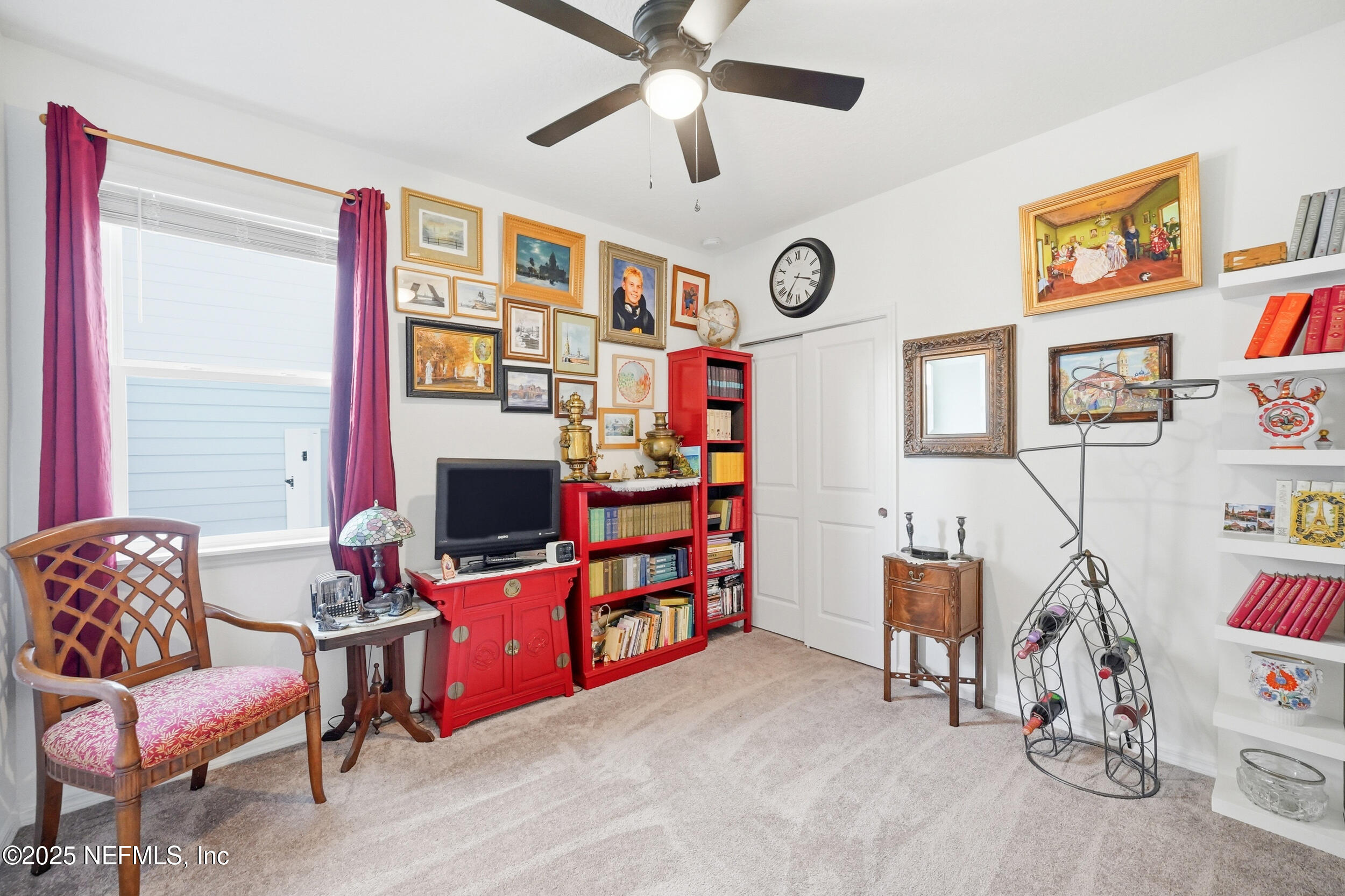 607 Blind Oak Circle St. Augustine, FL 32095 - Photo 17 of 39 a living room with furniture and a flat screen tv