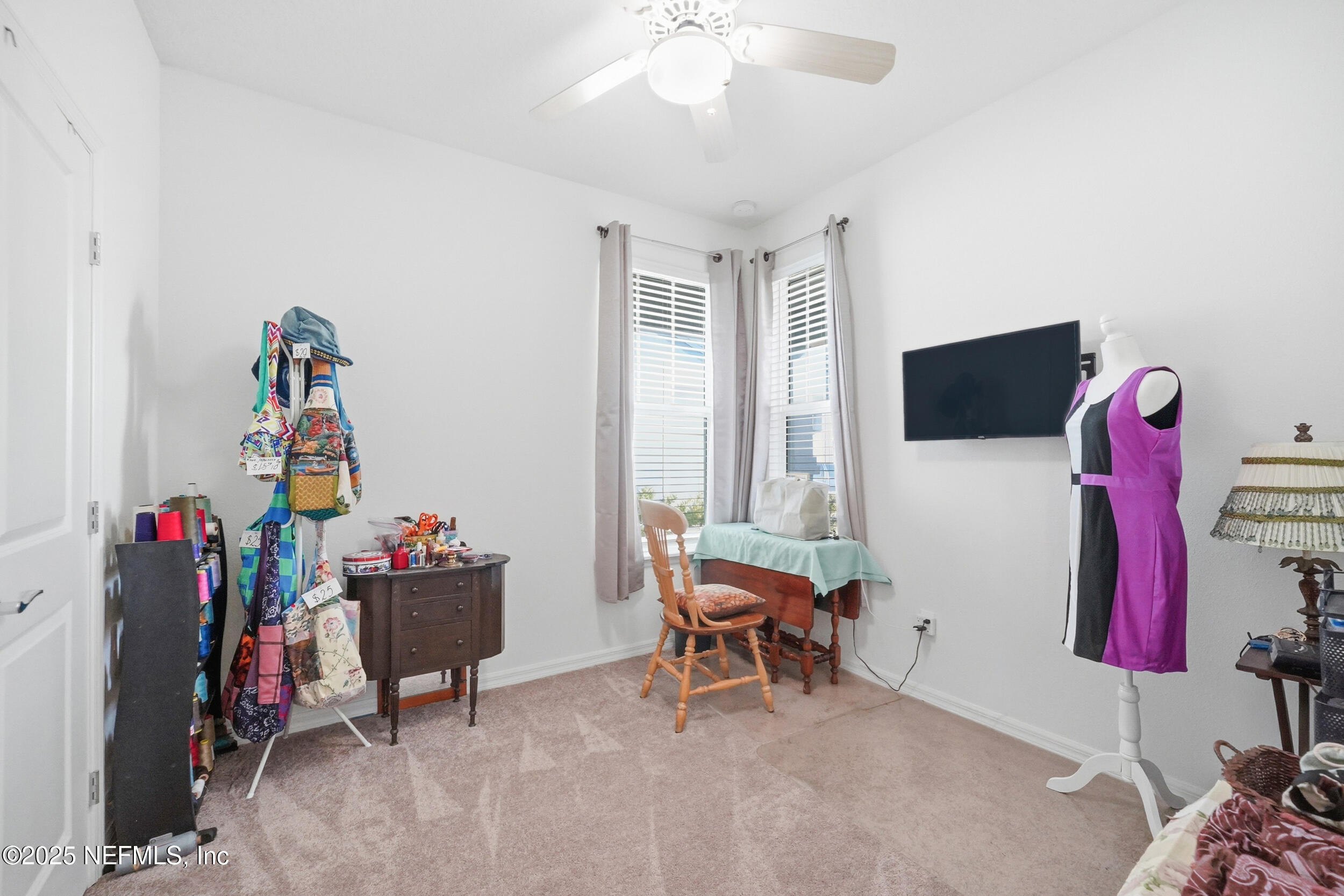 607 Blind Oak Circle St. Augustine, FL 32095 - Photo 18 of 39 a living room with furniture and a flat screen tv
