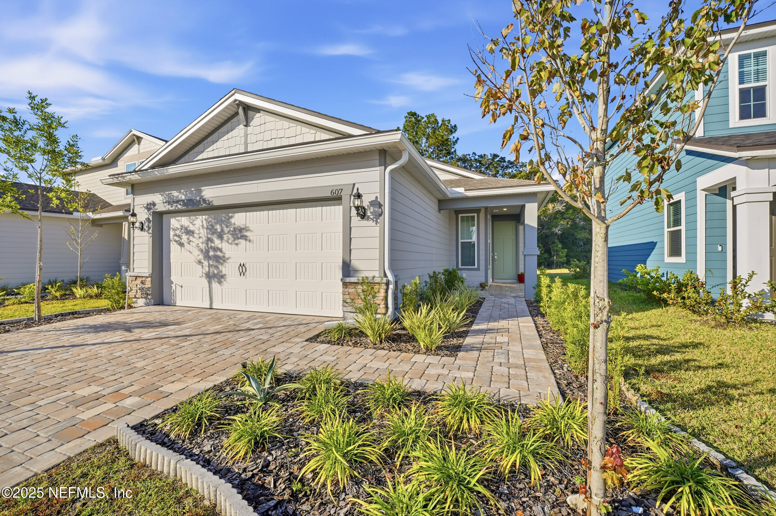 607 Blind Oak Circle St. Augustine, FL 32095 - Photo 4 of 39 a front view of a house with a yard