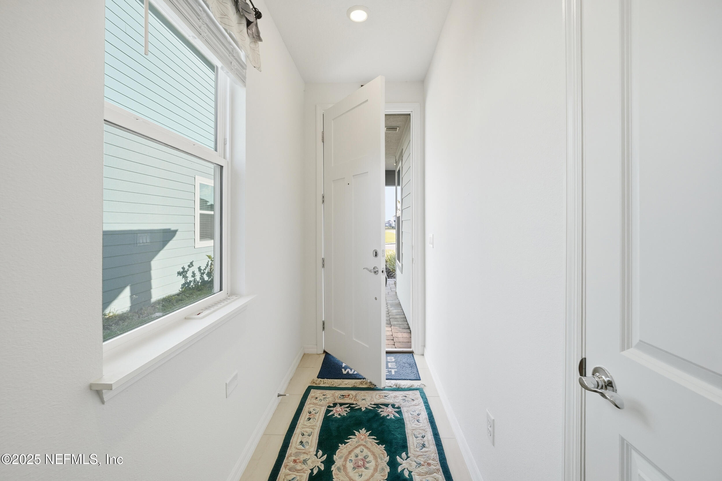 607 Blind Oak Circle St. Augustine, FL 32095 - Photo 6 of 39 a view of a hallway with windows and closet